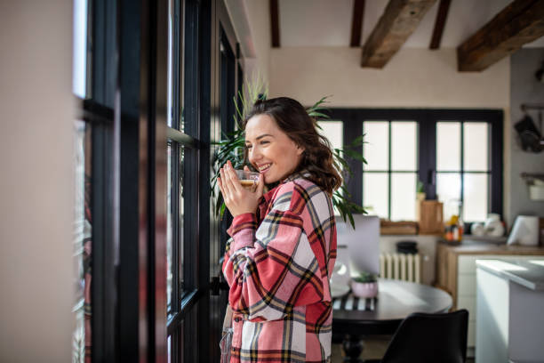 woman enjoying her automatic espresso made coffee at home